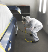 spraying paint in autobody shop